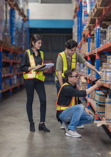Warehouse worker working in warehouse storage. Foreman or worker work at factory site check up products in site. Inventory worker working in  factory Storehouse